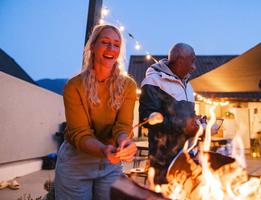 a group of people standing around a fire
